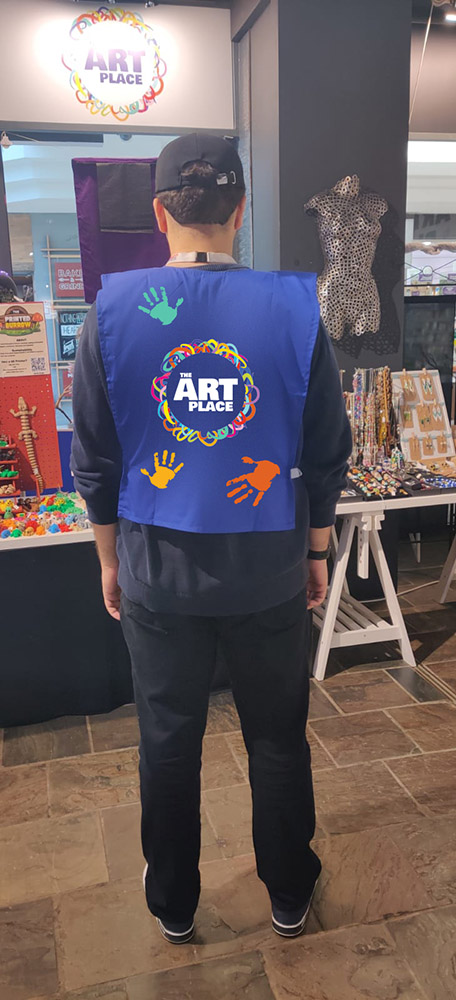 Volunteer shop greeter vest design for the Art Place Charity. Back. 2025.